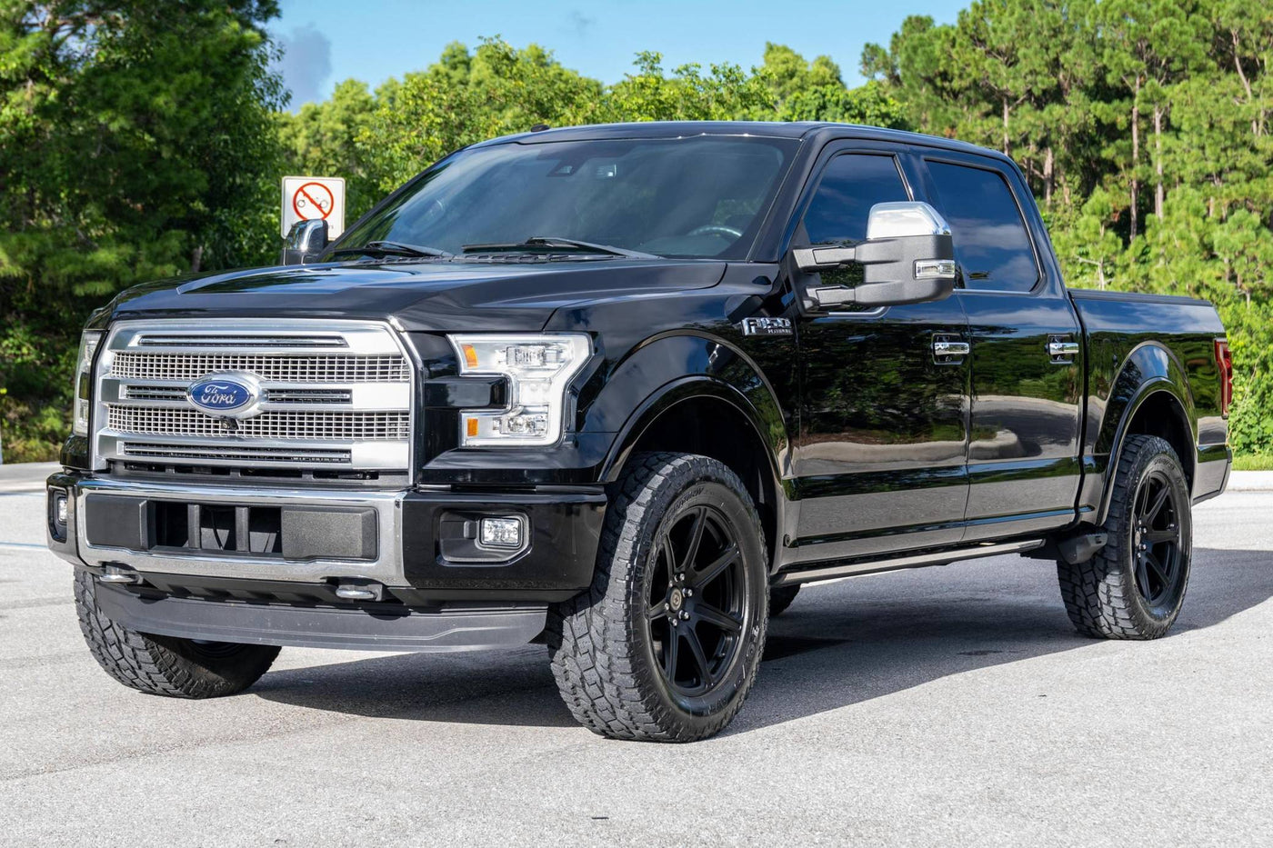 Before and after — RESIST Graphene Coating on a dark navy truck