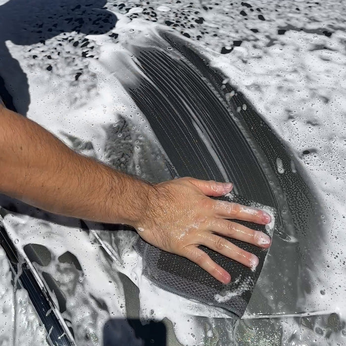 Glide the towel flat in straight lines with light pressure until it moves freely and quietly.