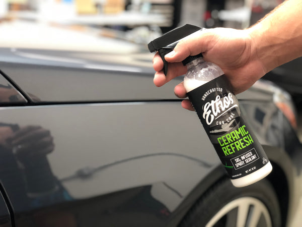 Applying a ceramic coating topper to maintain gloss and water beading