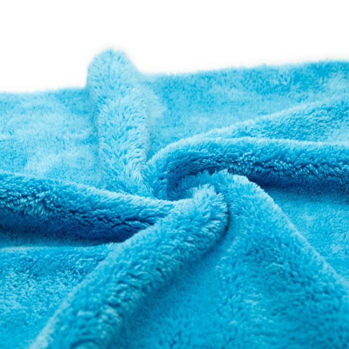 Machine wash warm with a mild detergent. No fabric softener or bleach, and no cotton in the load.
