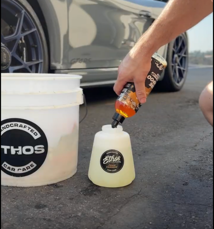 Add 2 to 3 oz of concentrated car shampoo to the bottle, then fill with water.