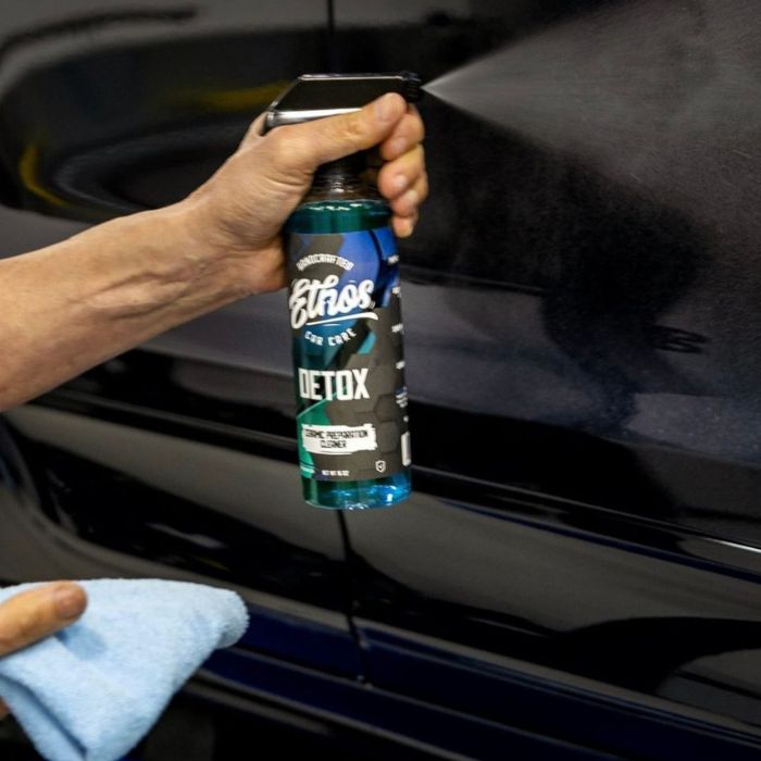 Wipe with a clean microfiber towel in overlapping passes until no residue or streaks remain.